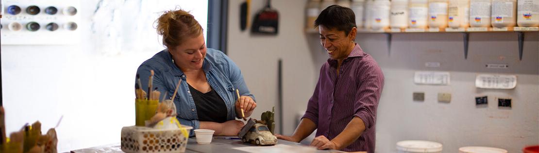 Two students work on a sculpture in a Pima Arts Studio 